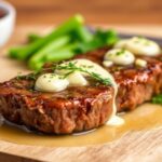 Garlic butter steak bites sizzling in skillet, garnished with parsley and coarse salt